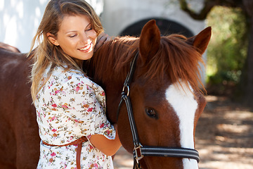 Image showing Happy, love and young woman with her horse on an outdoor farm for sports racing. Smile, training and confident female person from Canada with her equestrian animal or pet in countryside ranch.