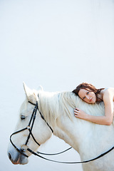 Image showing Wall, portrait and woman laying on her horse outdoor for sports racing or riding hobby. Smile, happy and young person from Canada with her equestrian animal or pet by a ranch for adventure and love.