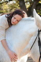 Image showing Nature, love and woman laying on her horse on an outdoor farm for sports racing. Smile, happy and young person from Canada with her equestrian animal or pet in countryside ranch for adventure.