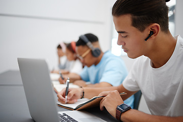 Image showing Studying, notebook and laptop with students in university classroom, library or workspace for learning, education and exam. Young college people writing lecture notes, research and digital technology