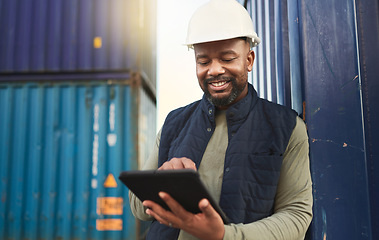 Image showing African american shipyard worker, shipping logistics and transportation of international commercial goods. Tablet for inventory management, import and export of cargo in the distribution supply chain