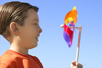 Image showing Boy with a spinning wheel pinwheel