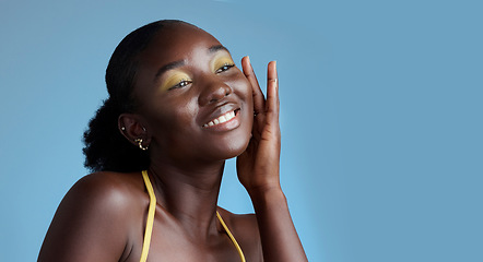 Image showing Yellow makeup and black woman face beauty for skincare cosmetic product with blue studio wall. Thinking, contemplating and pensive African girl feeling soft skin texture with eyeshadow mockup.