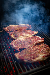 Image showing Beef steaks on grill