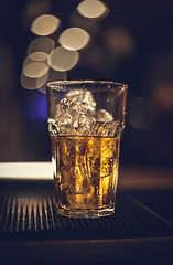 Image showing Glass of whiskey on the ice rocks