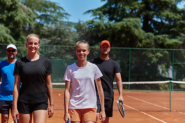 Image showing Tennis club together after hard training, showing their dedication, hard work, and teamwork.