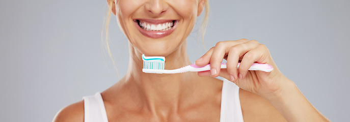 Image showing Dental, health and woman use toothbrush and toothpaste to clean teeth for healthy mouth, gums and happy. Confident, lady and girl relax shows oral hygiene with big smile, cleaning and brushing teeth.