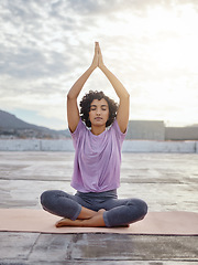 Image showing Yoga meditation, peace and woman praying for spiritual wellness and gratitude in the morning in the city of Singapore. Girl training her mind to relax with faith, zen and exercise for stress