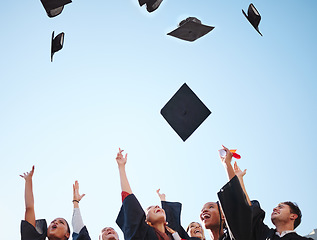 Image showing Graduation, students and graduate class throw caps in air feeling happy about education success at the ceremony. University or college men and women d friends celebrate proud certificate achievement