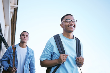 Image showing Student, university and education with friends on campus walking to class or travel at school. Scholarship, study and college with a man pupil and friend in backpacks ready for development