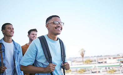 Image showing Student, education or travel with a man and friends walking to class on university or college campus as exchange students. Study, scholarship and learning with a male friend group in a city or town