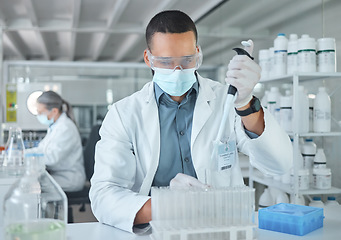 Image showing Covid lab, medical science or man scientist working on futuristic medicine research for healthcare at a laboratory. Doctor, nurse or chemical test on liquid for innovation, vaccine or DNA in hospital