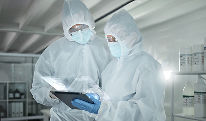 Image showing Covid, science and tablet with an engineer and technician working as a team on research on innovation in a lab. Teamwork, technology and analytics with a man and woman scientist in a laboratory