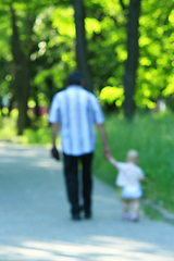 Image showing happy father with her baby walk by hand in the park