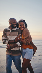 Image showing Happy, black couple, love and beach with smile for vacation in relationship together in the outdoors. African American man and woman enjoying bonding time on a ocean coast walk in South Africa