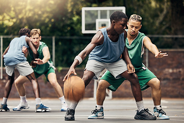 Image showing Sports, team and men playing basketball in a competition for college or university players with talent, skill and fitness. People in a competitive training match on an outdoor court using teamwork