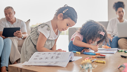 Image showing Book drawing, children learning and parents working on technology while kids do art in living room of house. Girl siblings being creative for learning while family does work on tech on sofa in lounge