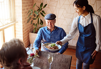 Image showing Love, food and old couple in restaurant with waiter on date for romance, happy and marriage. Retirement, fine dining and luxury with old man and woman at table for dinner service, wine and relax