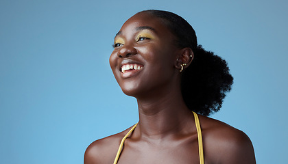 Image showing Smile, yellow makeup and fashion black woman happy and relax with a studio background with cosmetics. African American girl, lady or young female shows empowerment, proud and black girl magic.