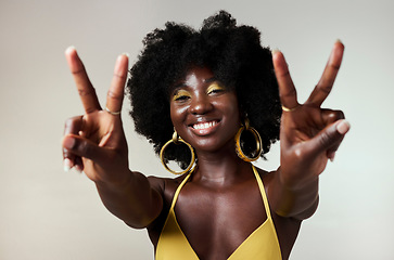 Image showing Black woman, peace sign and fashion afro hairstyle on studio background with style, trend and makeup cosmetics. Portrait, fun or happy beauty model with playful and good energy hands gesture in Congo