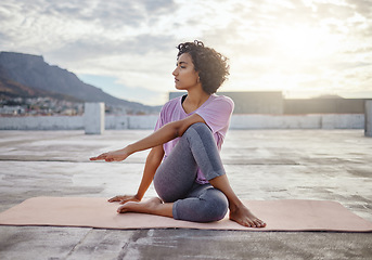 Image showing Stretching, yoga and wellness woman exercise outdoor town and city. Exercise, fitness and calm person meditation on ground for workout, pilates or training for healthy body, spiritual and awareness