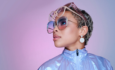 Image showing Sunglasses, fashion and black woman in neon clothes in color studio mock up space for advertising and marketing. Gen z girl or african model with futuristic vaporwave style on purple pink background