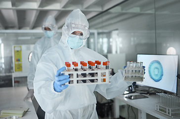 Image showing Lab, science and research on virus, dna or blood in vial for analysis to find medical solution. Scientist, ppe and laboratory with samples to work on innovation in healthcare, medicine or biology