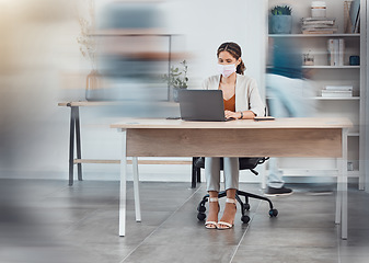 Image showing Covid employee, office busy and woman on the internet with a laptop at a desk in an open creative workplace. Marketing employee with face mask at a fast startup company for safety from virus