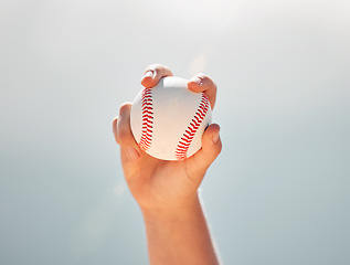 Image showing Baseball, athlete hands and ball sports while showing grip of pitcher against a clear blue sky. Exercise, game and softball with a professional player ready to throw or pitch during a match outside