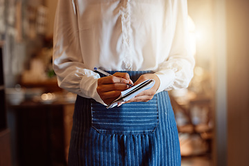 Image showing Food order, restaurant and hands of waiter writing notes on paper about lunch while working at a cafe. Flare of a waitress or barista with notebook for dinner service at fine dining coffee shop
