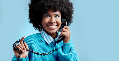 Image showing Telecom landline, phone or black woman talking, communication on blue mockup studio background. Happy, smile or young African girl model speaking to contact on vintage phone with mock up space