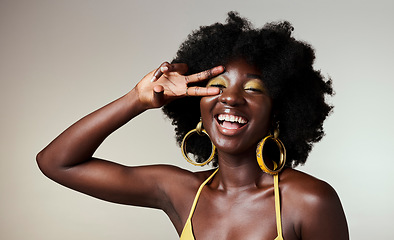 Image showing Beauty peace sign, black woman with gold makeup on healthy skin and jewelry in mockup studio background. Portrait of happy model with afro, creative cosmetic designer backdrop and female empowerment