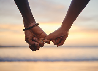Image showing Love, trust and holding hands with couple at beach on Cancun vacation at sunset for happy, goals and support. Summer, vision and travel with black man and woman by the ocean together for holiday
