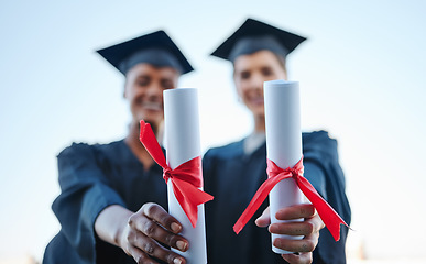 Image showing Diploma, success and hands at university graduation with celebration together at school. Students with paper certificate award after scholarship achievement in college education for future motivation