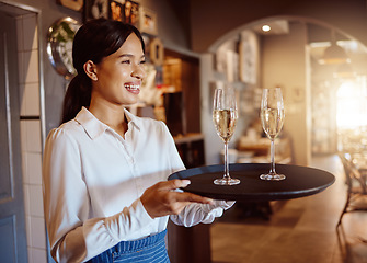 Image showing Waitress, wine glass tray and hospitality service in restaurant, cafe and fine dining winery. Happy woman, bartender and sommelier catering luxury champagne, alcohol glasses or expensive liquor drink