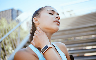 Image showing Injury, neck and pain of sports woman during risk workout on building steps in the city. Fitness, accident and neck pain in training and exercise activity, discomfort after morning cardio run