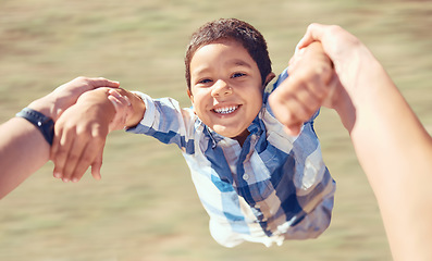 Image showing Family, happy and swing with child and arms of parent in garden for fun, smile or love. Health, support and holding hands with son and dad playing outdoors for summer, lifestyle and motion together