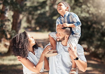 Image showing Love, relax and happy family laughing and bonding on outdoor walk in a park, cheerful and carefree. Playing, smiling and excited boy enjoying free time with his loving parents in nature on weekend