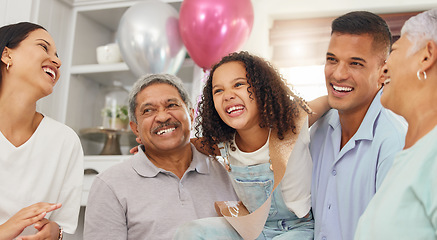 Image showing Happy birthday, party and girl in celebration with family as her mother, father and grandparents enjoy a special day together. Dad, mom and excited child celebrating with an elderly woman and old man