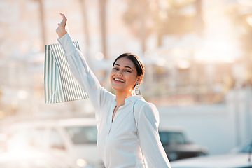 Image showing Shopping bag, customer and retail woman in city bokeh street for fashion, clothes or gift. Celebration of discount, sale and person clothes luxury, wealth or urban lifestyle portrait walking outdoor