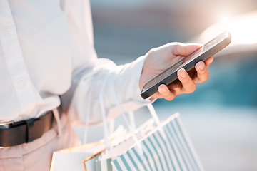 Image showing Phone, shopping and social media with a woman customer doing an internet search for a sale, deal or bargain. Hand, ecommerce and retail with a female shopper looking for a product online on a mobile