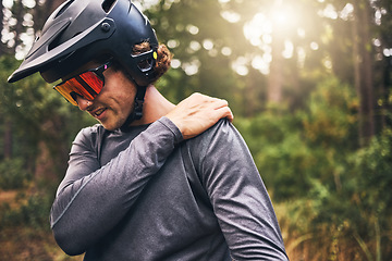 Image showing Bike cyclist, fitness and injury in nature forest, environment or Australian woods after exercise, training and workout. Shoulder pain, medical emergency and healthcare for sports man after accident