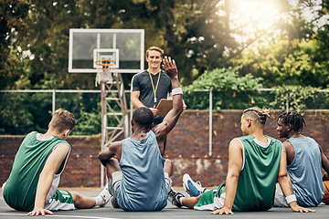 Image showing Basketball coaching, training meeting and team with question for coach during sports on outdoor court. Professional athlete sport group talking about university sport game on campus in Canada