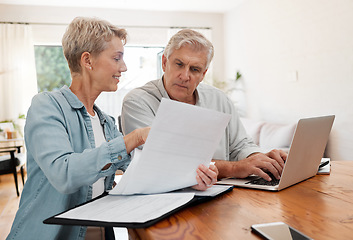 Image showing Senior couple, laptop and home finance while reading paperwork documents and typing on computer for retirement savings, mortgage and online banking. Mature man and woman doing bill payment or booking