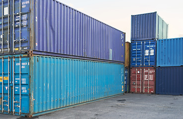 Image showing Container, logistics and port at storage in shipyard for global supply chain on sea. Shipping, cargo and transport distribution of goods, for import and export at international harbour in Cape Town