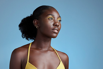 Image showing Black woman beauty and yellow makeup cosmetics model for eye product in blue background studio mockup. Nigeria African young girl pose for natural hair care, healthy skincare and afro empowerment