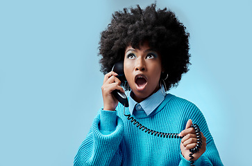 Image showing Telephone, wow and surprise black woman with gossip, fake news or fashion sale with blue studio background mockup for advertising and marketing. Shocked african girl on phone call for a discount deal