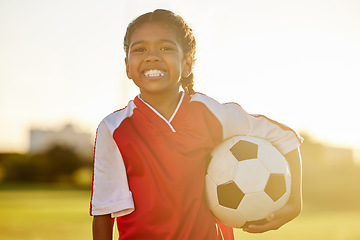 Image showing Young fitness girl, football or soccer player learning, training and exercise for healthy child development. Portrait of young happy sports kid on a field or stadium practicing for a game at sunset