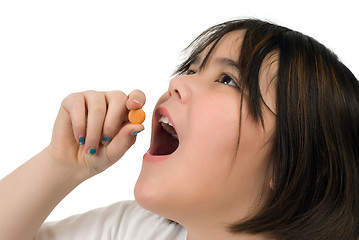 Image showing Girl Taking Vitamin C