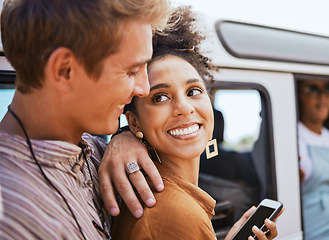 Image showing Couple, phone and travel in a city with black woman and man bonding and waiting for a taxi. Tourist, traffic and transport for cheerful interracial soulmate sharing romantic moment in a street